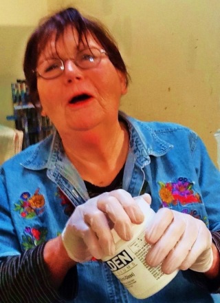 Artist Judith Toller pleading for my man hands to open her jar.